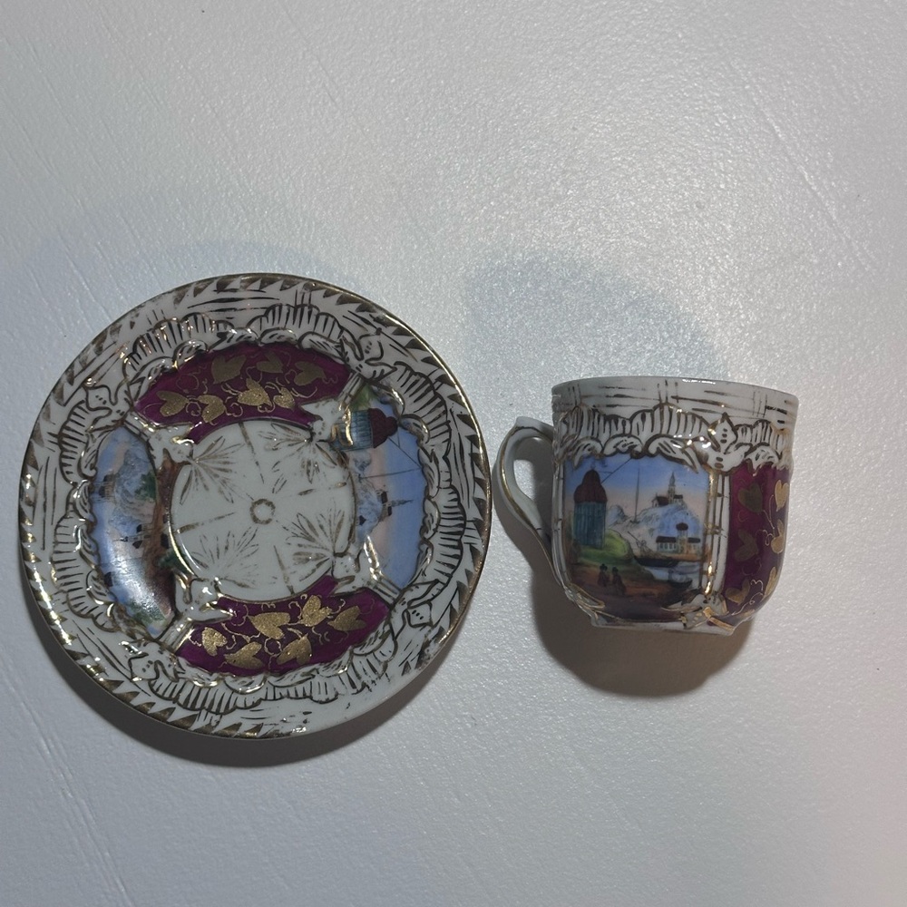 Vintage Porcelain Cup and Saucer Set with Scenic Design